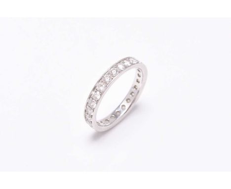 A platinum diamond eternity ring, the brilliant cut diamonds claw set to platinum shank, ring size M 1/2, weight approx 3.9gC