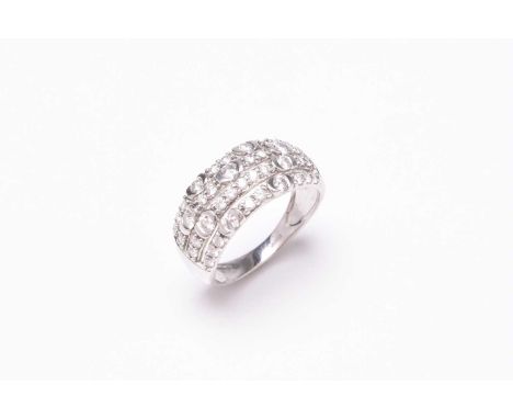 A platinum diamond ring, designed as four rows of graduated brilliant cut diamonds claw and collet set in platinum, ring size