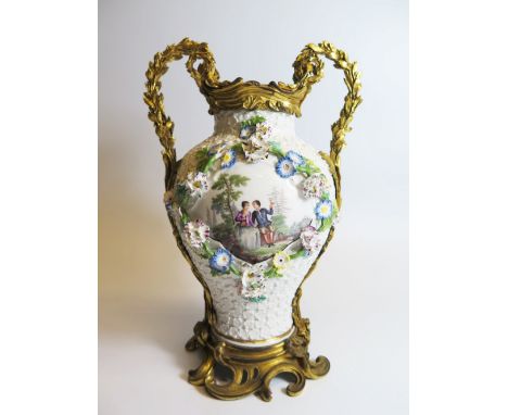 A Louis XV Ormolu Mounted Meissen 'Maiblumen' Porcelain Vase, c.1750The baluster shaped body painted with fêtes champêtres sc