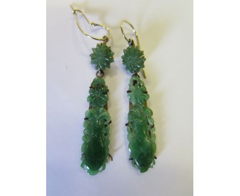 A Pair of Jade Pendant Earrings carved as baluster vases with flowers, 49mm drop 