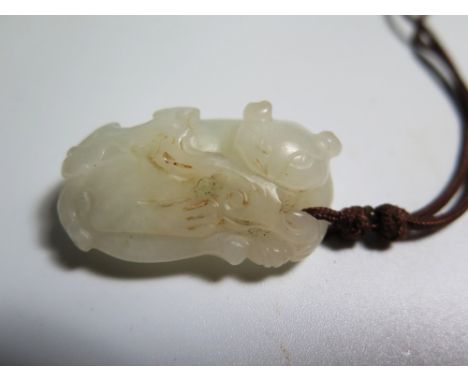 A Carved Jade Model of Rucumbent Lion 