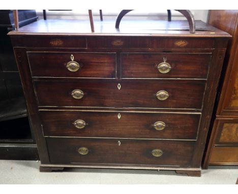 A 19th century mahogany and shell paterae inlaid "Scotch" chest of two shallow, two short and three long drawers, on bracket 