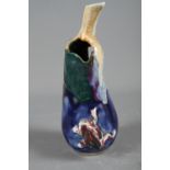 A 20th century Chinese Jun glazed pottery pear with applied frog decoration, a Staffordshire pottery
