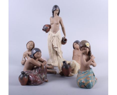 Five brown bodied Lladro figures of half-naked girls