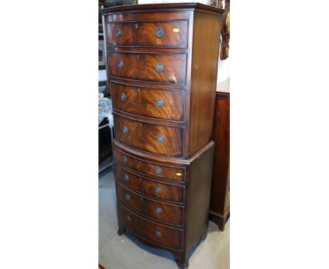 A figured mahogany bowfront chest of eight drawers, on bracket feet, 23" wide