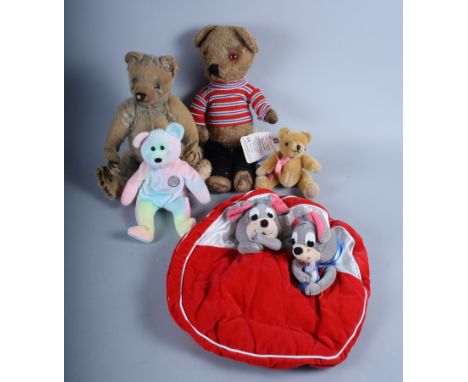 A much loved early 20th century teddy bear and a number of other soft toys, various