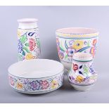 Four pieces of mid 20th century floral decorated Poole Pottery and a Coalport strawberry and cream