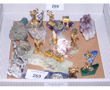 A collection of mineral samples, with silvered and gilt figures of miners and gold panners, and other mineral samples, variou