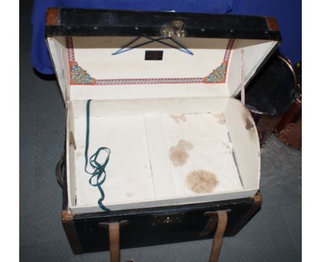 A leather dome top trunk