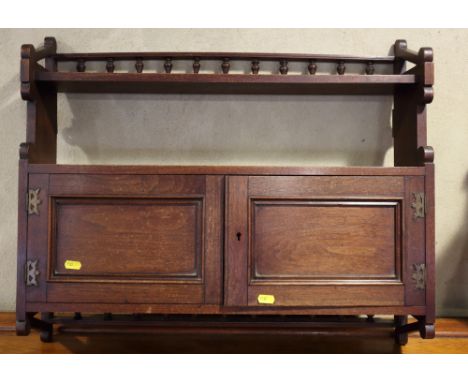 A late 19th century mahogany wall cupboard with spindle gallery over and one shelf, 25" wide