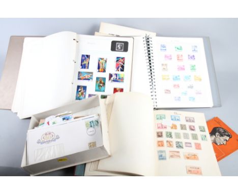 A collection of British and World stamps, including first day covers, loose and in albums