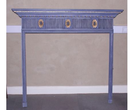 A carved and painted pine fire surround of Adam design, aperture 44" x 39"
