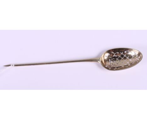 A Georgian silver gilt bottom marked mote spoon with spear head finial and pierced bowl