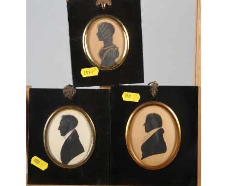 Two early 19th century portrait silhouettes, unknown gentlemen, and a similar companion portrait of a girl, in ebonised frame
