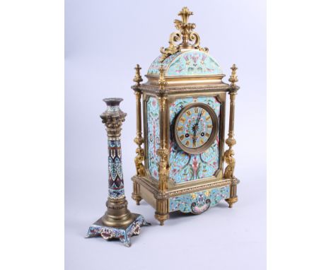 A French 19th century champleve enamelled mantel clock with eight-day striking movement and a companion candlestick, clock 17