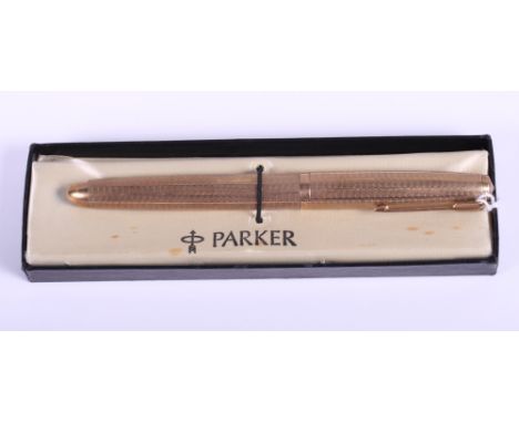 A 9ct gold cased Parker fountain pen, with engine turned decoration, in original fitted case