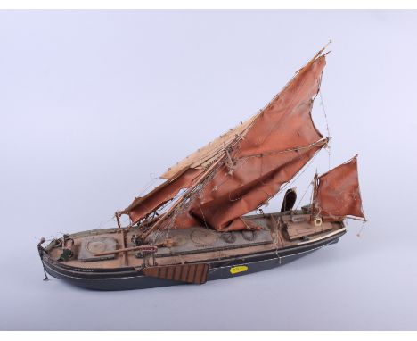 A scratch built wooden scale model of the Thames Barge Giralda, 13 1/2" long, and a scale model of a boat, in glass case, 11"