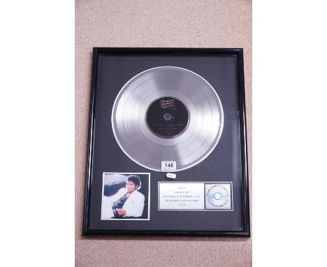 Music Memorabilia - Framed &amp; Glazed Michael Jackson Thriller platinum record award in recognition of its worldwide succes