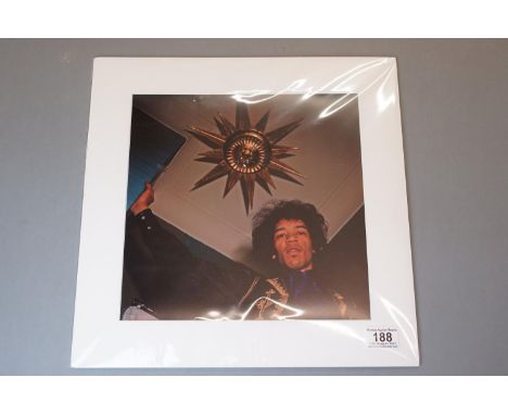 Music Memorabilia - Photograph of Jimi Hendrix at the top of the stairs in his Brook St house, mounted. 