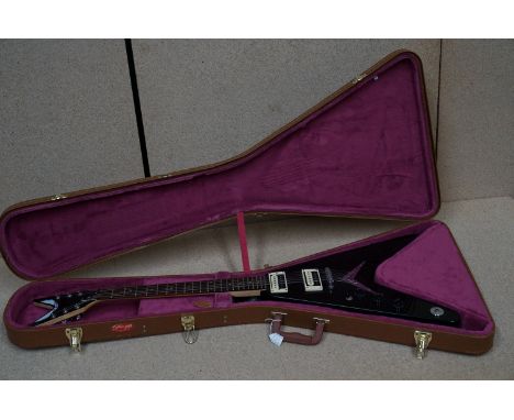 Guitar - A Chinese made Dean VXL flying V style electric guitar finished in black.  Comes with Stagg hard case 
