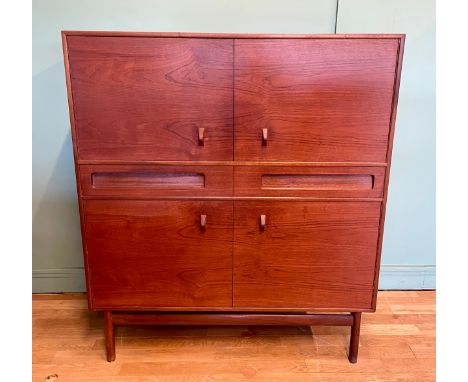 A.H. McIntosh & Co Ltd; a mid 20th century teak drinks/cocktail cabinet, designed by Tom Robertson, the top section with two 