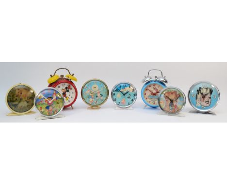 Eight novelty alarm clocks, with designs including Mickey Mouse, Snoopy and Noddy. All manual wind, mid 20th Century.