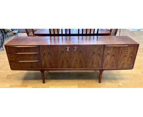 Tom Robertson for A.H. McIntosh &amp; Co Ltd - A mid 20th century rosewood sideboard fitted with a bank of three central draw