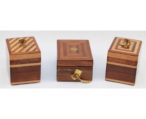 A gents Casio 4304 4305 quartz wristwatch in a mahogany and box wood inlaid presentation box, together with two similar woode