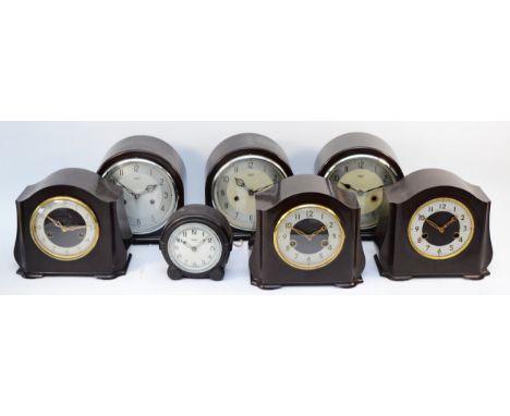 Six Smiths manual movement mantel clocks, c.1950s together with an electric Farranti example. Tallest 20cm.