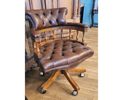 A brown leather button back swivel and tilt office chair, sold with a purchase receipt from Dee, Atkinson &amp; Harrison for 