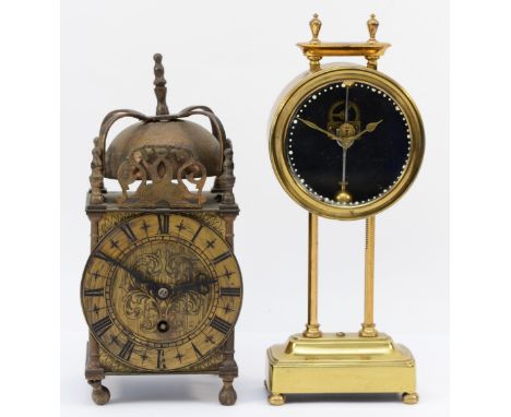 An early 20th Century brass gravity clock, 8 day movement, 25cm high. Together with a mid 20th Century English brass lantern 