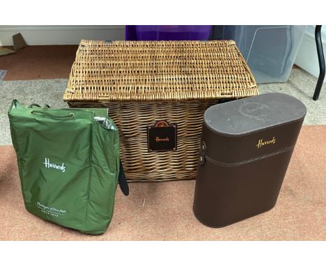 A Harrods wicker basket hamper with a Harrods three bottle carry case.