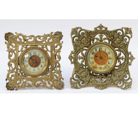 Two ornate brass mantel clocks, both with Arabic numerals, manual wind. 13cm &amp; 12cm high.
