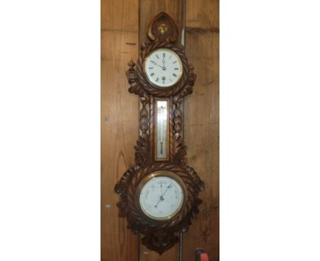 A mid 20th Century carved oak wall barometer/ thermometer, incorporating a manual wind 8 day clock. 55cm long