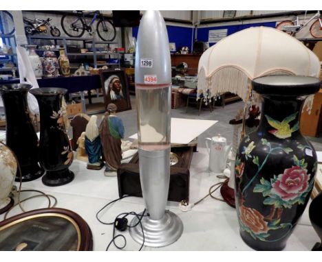 Trident lava lamp. All electrical items in this lot have been PAT tested for safety and have passed. This does not confirm th