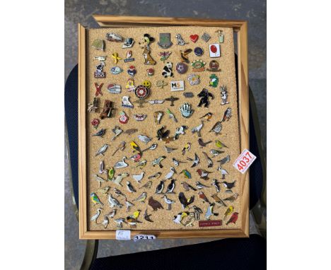 Collection of enamel pin badges on a cork board. board 30 x 40cm with damages. Not available for in-house P&amp;P 