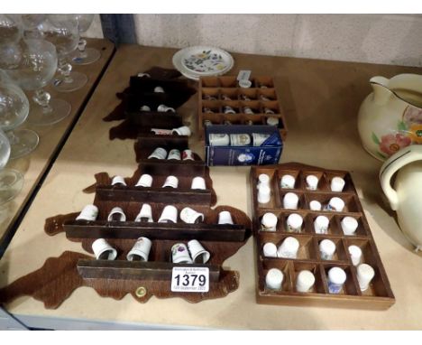 Quantity of ceramic thimbles on display stands. Not available for in-house P&amp;P 
