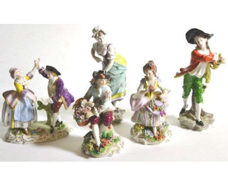 A pair of Continental porcelain figures of flower sellers; a pair of Sitzendorf porcelain figures and a further Sitzendorf gr