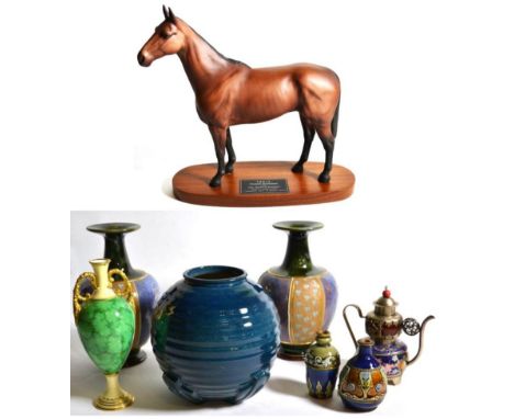 A pair of Royal Doulton vases; a Beswick model of Arkle; two small Doulton vases and other ceramics 