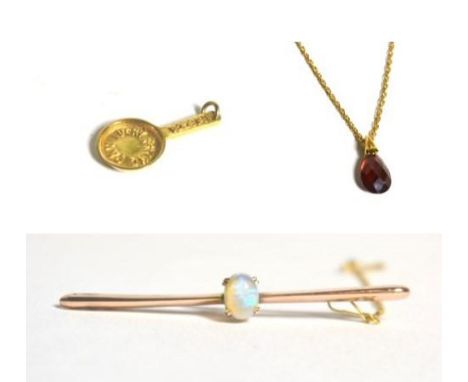 An opal bar brooch, a 9 carat gold 'LUCKY FRYING PAN' charm, and a garnet pendant on 9 carat gold Prince of Wales chain (3)