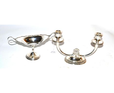 A silver twin branch candlestick, Birmingham 1996; and a twin handled silver pedestal dish, James Dixon &amp; Son, Sheffield 