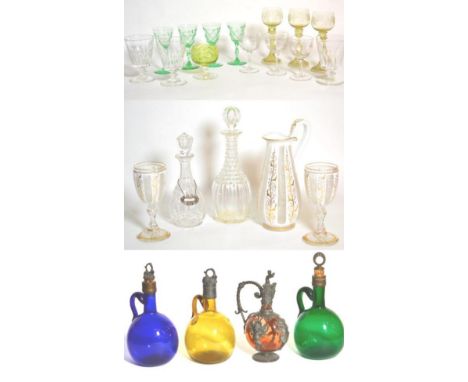 Glassware comprising Victorian white-overlay jug and a pair of goblets; four coloured flagons; three rummers; two decanters w