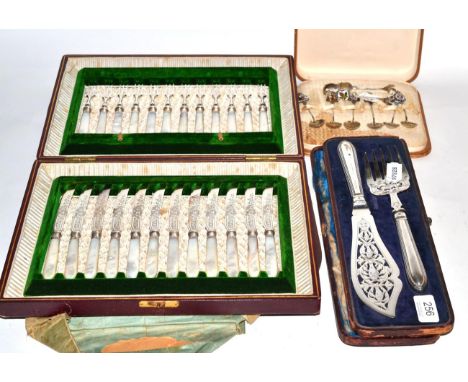 A cased set of fruit knives and forks, twelve settings, silver ferrules, mother of pearl handles; with a set of Canadian Ster