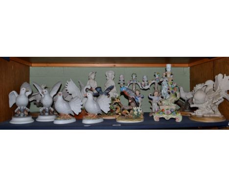A pair of Continental porcelain figural candelabra (one nozzle detached); a further porcelain figural candlestick; various mo