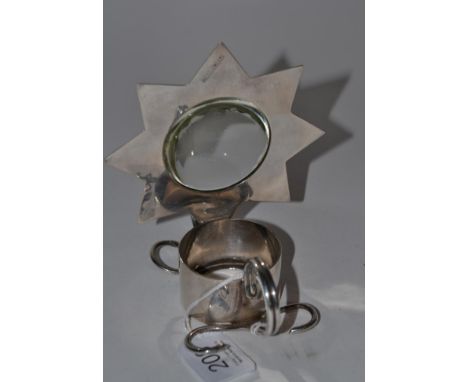 A Hukin and Heath silver plated lamp/chamberstick, with convex glass magnifier within a star shaped frame, stamped ''9189'' a