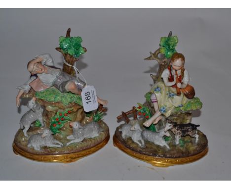 A pair of Sitzendorf porcelain models of a Shepherd and a Shepherdess 