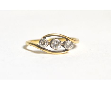 An old cut diamond three stone ring, total estimated diamond weight 0.25 carat approximately, finger size R, stamped '18CT', 