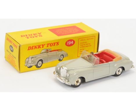 Dinky Toys 194 Bentley Coupe - Grey body, red interior with figure, light beige tonneau, chrome trim and spun hubs - Good Plu