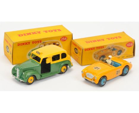 Dinky Toys A pair - (1) 109 Austin Healey Sports Car - Yellow, mid-blue including rigid hubs, (2) 254 Austin "Taxi" - Two-Ton