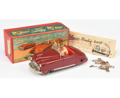 Schuco (US Zone, Germany) Examico&nbsp; 4012 Radio Car -&nbsp; Maroon body, red interior&nbsp; Clockwork motor - Fair in a Go